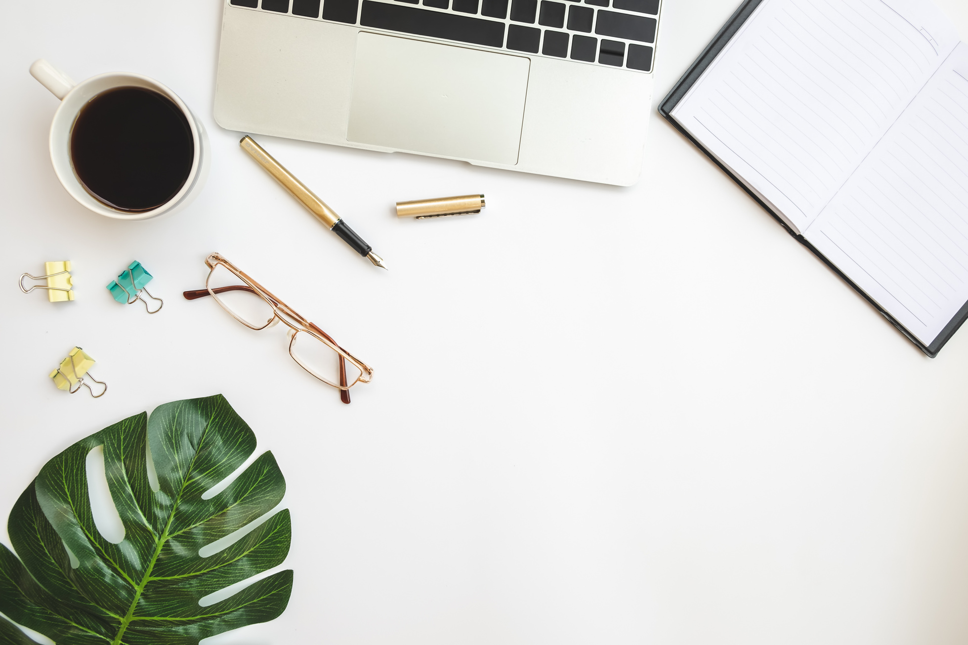 Office Desk Table with Laptop and Essentials Flatlay